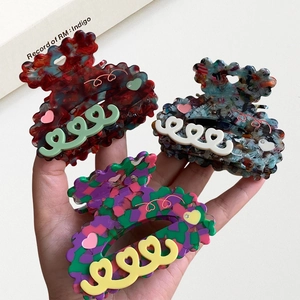 Colorful acetate resin heart hair claws with marble pattern and sparkling rhinestones