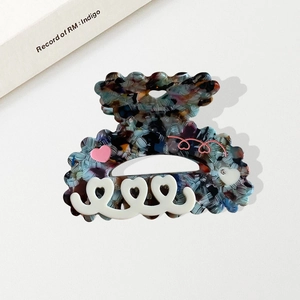 Colorful floral acetate hair claw clip with pink hearts and vintage tortoiseshell pattern
