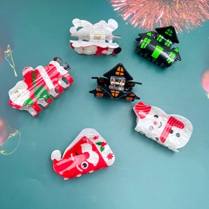 Festive hair claws with Santa Claus and Snowman designs for seasonal hair styling