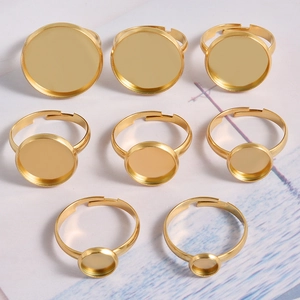 Eight adjustable gold stainless steel ring bases with round bezel trays for DIY jewelry