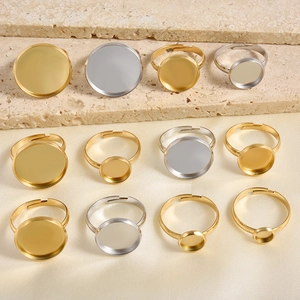 Close-up of adjustable stainless steel ring blanks in gold and silver for DIY jewelry