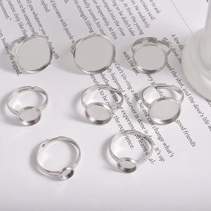 Selection of silver stainless steel adjustable ring blanks with round bezel settings for DIY
