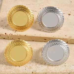 Close-up of gold and silver textured stainless steel bezel cups for DIY jewelry