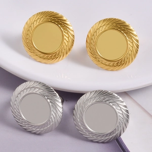Polished round stud earrings with wheat pattern texture in gold and silver finish