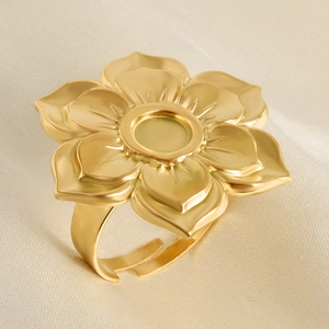 Detailed macro view of matte golden flower ring base with layered petal setting