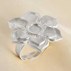 Macro detail of silver lotus flower ring base with adjustable band on satin