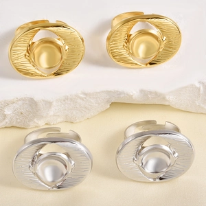 Minimalist irregular chunky gold and silver stackable rings on stone platform