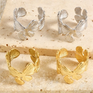 Detailed view of stainless steel butterfly ginkgo leaf rings with textured veins