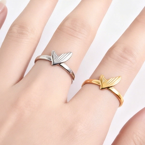 Minimalist fishtail rings in gold and silver finish shown on hand for women and men