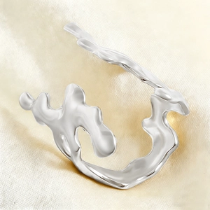 Macro shot of silver fluid irregular coral style ring with mirror polished texture