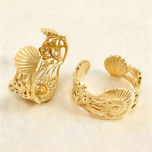 Golden seashell and spiral open rings set with minimalist nautical ocean beach design