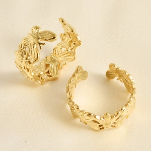 Close-up of two golden hollow butterfly rings with an open adjustable design set