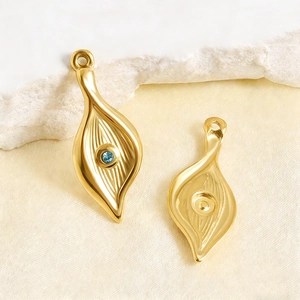 Golden leaf pendant with blue gemstone and radial texture for DIY necklace jewelry