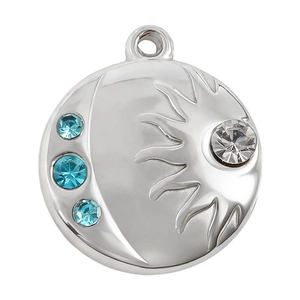 Macro shot of sun and moon pendant in 18k gold plated steel with blue and white gems