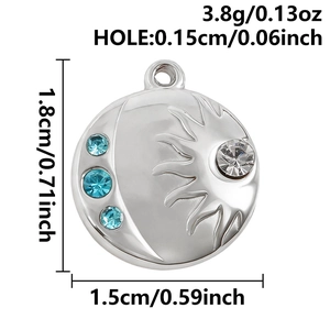 Detailed view of sun and moon pendant with blue crystals and measurement specs