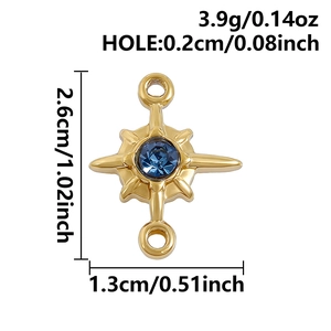 Macro view of gold four-pointed star pendant with blue gemstone and dimension markers