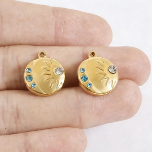 18k gold plated stainless steel sun and moon pendant with sparkling blue crystals