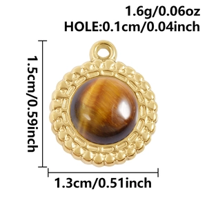 Detail of 18k gold plated round pendant with tiger eye stone and petal border