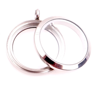 Detailed view of an open silver stainless steel locket pendant with glass panels