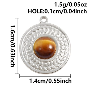 Macro detail of round tiger eye stone pendant with wheat pattern in silver finish
