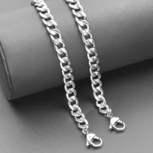 Detailed close-up of a silver stainless steel Cuban link chain with secure lobster clasps