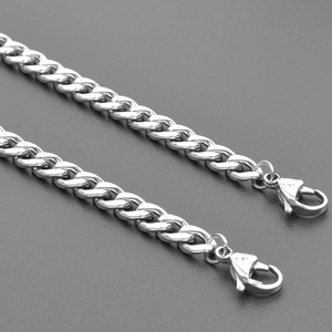 Detail of silver stainless steel Cuban link chain with sturdy lobster claw clasps