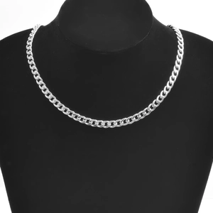 Detailed view of a silver stainless steel cuban curb chain necklace on a black bust