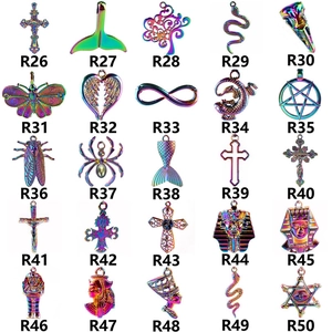 Macro display of 25 rainbow-colored stainless steel charms featuring mystical symbols