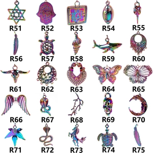Detailed grid view of 25 rainbow stainless steel charms with SKU R51 to R75 references