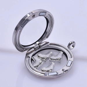 Silver floating charm locket with white ice skate charms and clear glass cover
