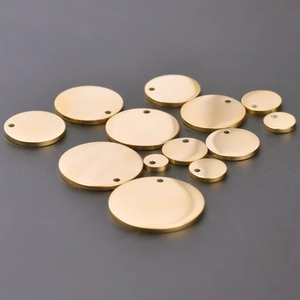 Detailed set of polished gold stainless steel round charms in various sizes for DIY jewelry