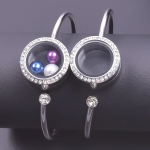 Detail of 25mm silver stainless steel floating locket bracelet with rhinestones and pearls