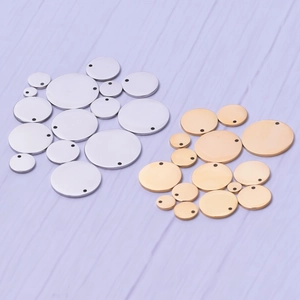Polished stainless steel round pendant tags in gold and silver colors with pre-drilled holes