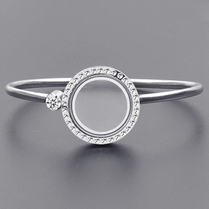 Close-up of 25mm round stainless steel floating locket bracelet with sparkling crystals