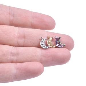 Crescent moon pendants with cubic zirconia in silver, gold, and rainbow stainless steel
