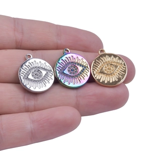 Three-color evil eye pendant charms in silver, gold, and rainbow stainless steel finishes