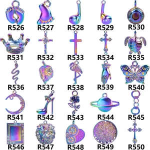 Detail view of 25 rainbow plated stainless steel charms including crowns and butterflies