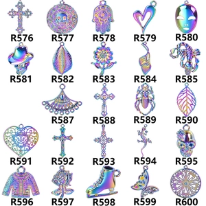 Rainbow vacuum-plated alloy charms in various designs like Fatima hand and cross