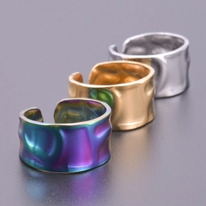 Macro detail of wide irregular hammered texture on adjustable stainless steel rings