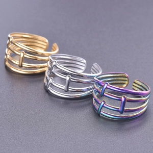 Close-up of adjustable multi-layer rings in gold, silver and rainbow colors