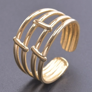 Macro view of adjustable gold-plated wide band ring with modern triple hollow layer design