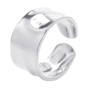 Detailed view of wide open ring with irregular hammered texture in polished steel