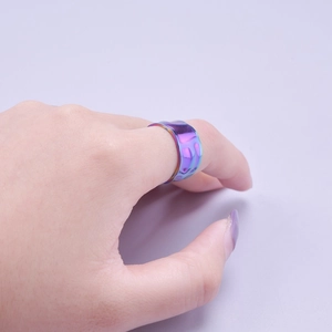 Rainbow stainless steel adjustable open ring with hammered texture on index finger