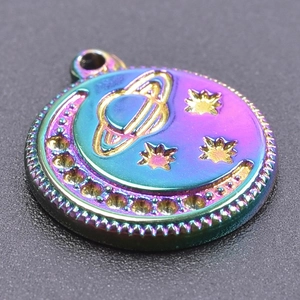 Macro shot of colorful iridescent planet and moon pendant with beaded edge detail