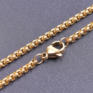 Macro shot of 2.5mm gold stainless steel box chain necklace with durable lobster clasp