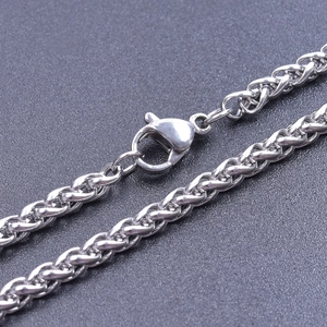 Detail of silver stainless steel wheat chain showing lobster clasp and woven texture