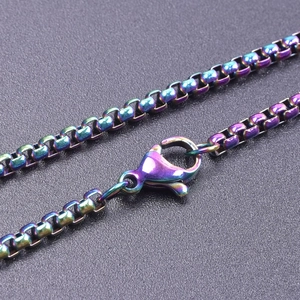 Macro detail of iridescent 2.5mm stainless steel box chain with lobster clasp closure