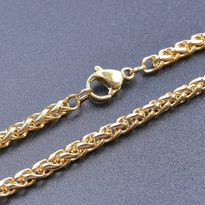 Detailed close-up of 3mm golden spiga chain with secure lobster clasp finish