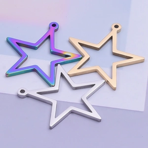 Close-up of star shaped hollow pendants in gold, silver, and rainbow steel finish