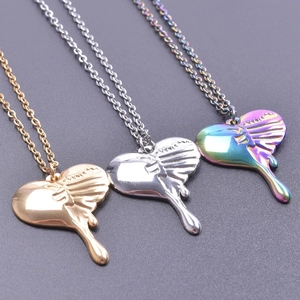 Three melting heart pendants in gold, silver, and rainbow colors with fine link chains